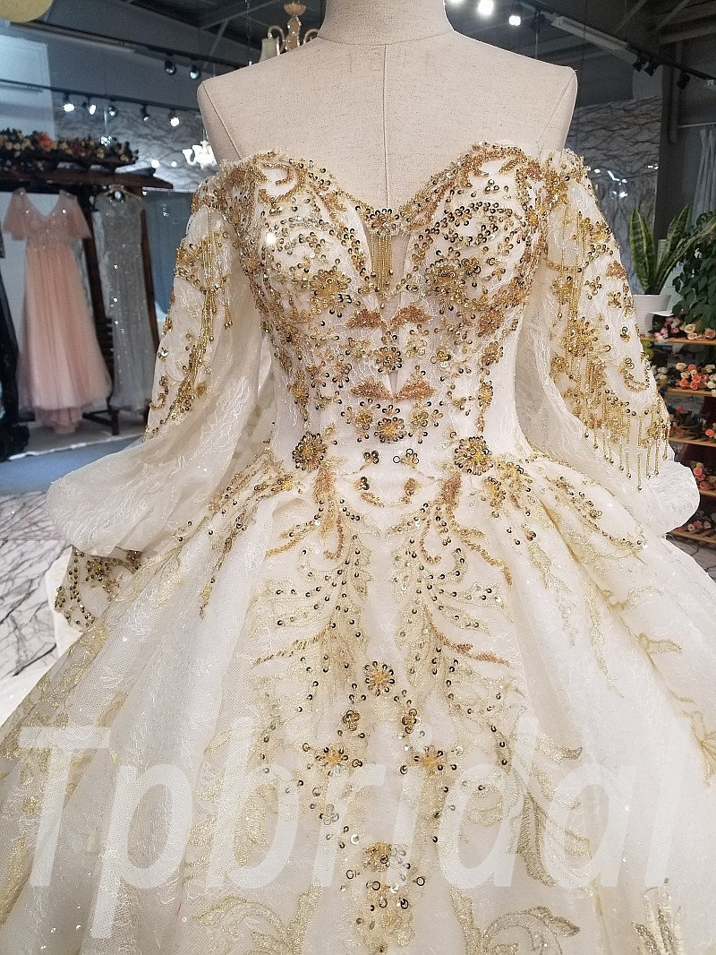 white and gold wedding dress