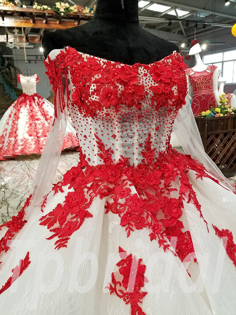 Premium Photo | A woman in a dress with a red and black dress and a red and  white skirt.